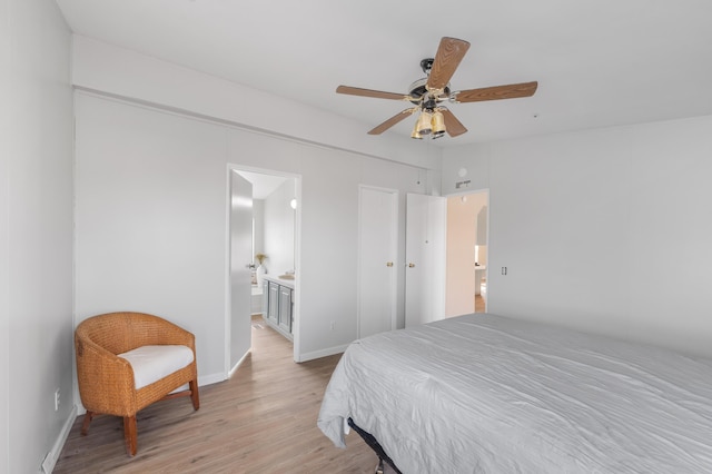 bedroom featuring ceiling fan, connected bathroom, and light hardwood / wood-style floors