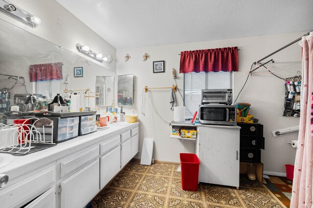 bathroom featuring tile patterned flooring