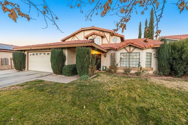 view of front of home featuring a garage and a front lawn