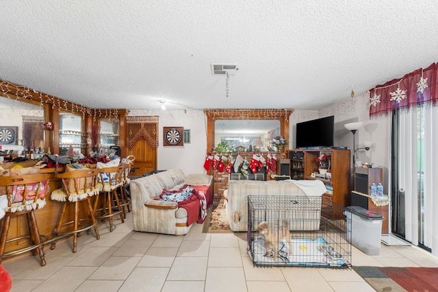 tiled living room with a textured ceiling