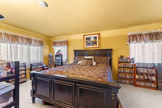 bedroom with light colored carpet