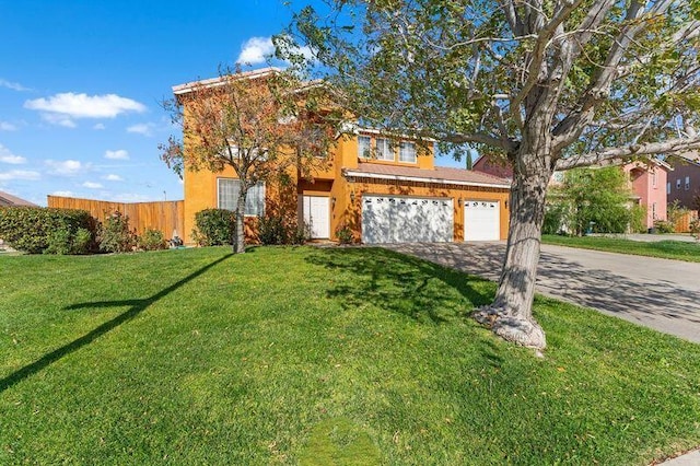 view of front of house with a garage and a front yard