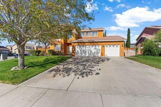 view of front property with a garage and a front lawn