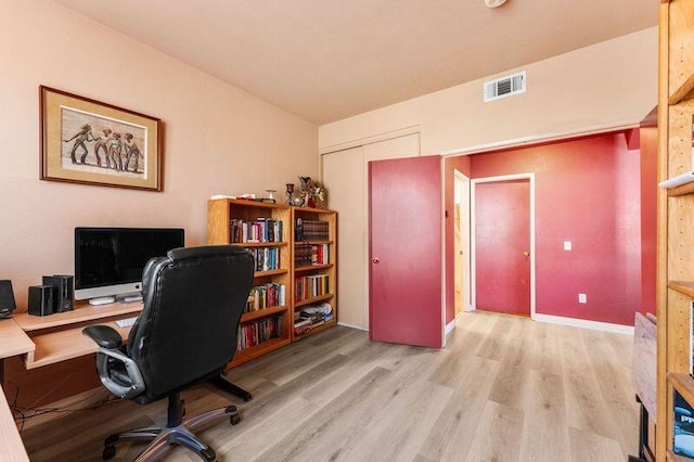 office space with light hardwood / wood-style flooring