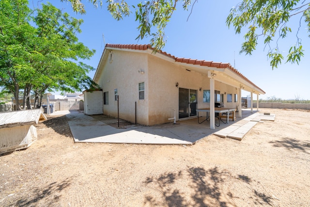 back of property featuring a patio area