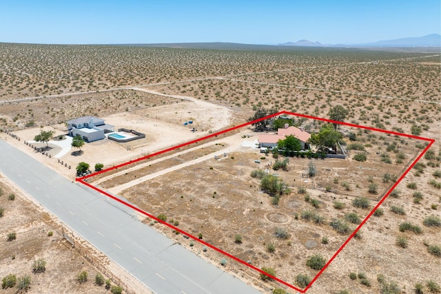 birds eye view of property featuring a mountain view