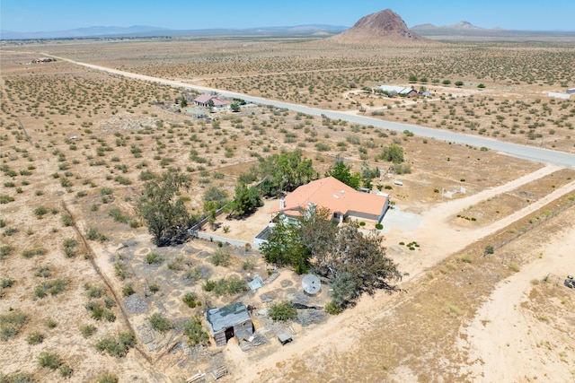 birds eye view of property featuring a mountain view