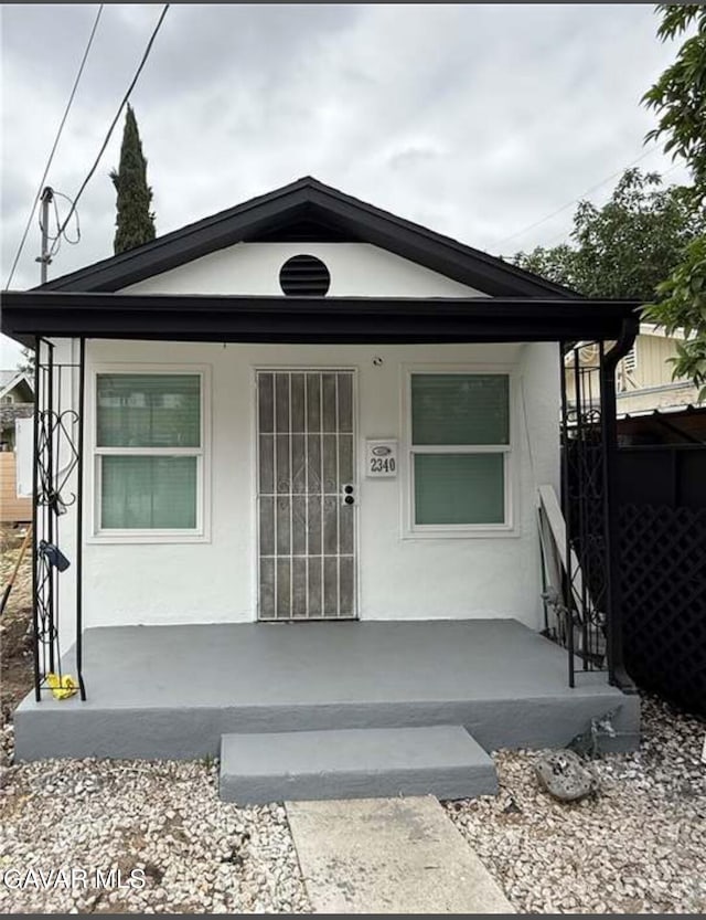 2340 N Thomas St, Los Angeles, CA 90031 - view of front of property featuring a porch and stucco siding