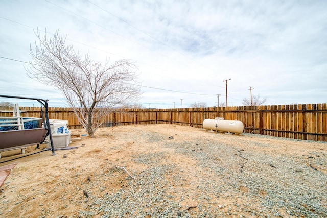 view of yard with a fenced backyard