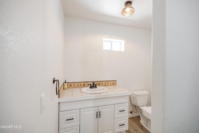 3807 Paula Ln, Lancaster, CA 93535 - bathroom featuring vanity and wood finished floors