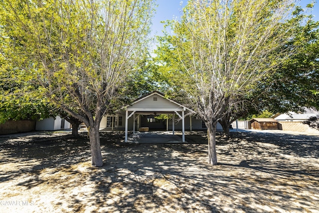 3807 Paula Ln, Lancaster, CA 93535 - view of property hidden behind natural elements featuring a storage shed