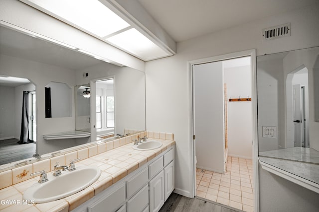 3807 Paula Ln, Lancaster, CA 93535 - full bathroom featuring double vanity and a ceiling fan