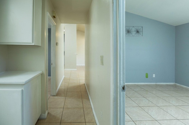 corridor with light tile patterned floors