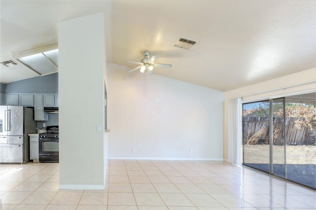 unfurnished living room featuring ceiling fan, light tile patterned flooring, and lofted ceiling