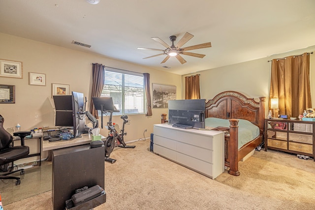 bedroom with an office area and carpet