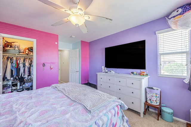 bedroom featuring carpet floors, ceiling fan, a closet, and baseboards