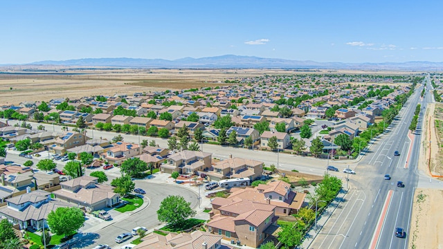 aerial view of property's location with nearby suburban area and mountains