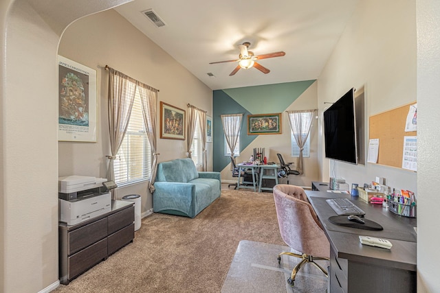 carpeted office featuring a ceiling fan and baseboards