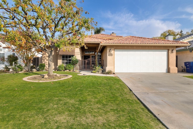 view of front of house with a front yard and a garage