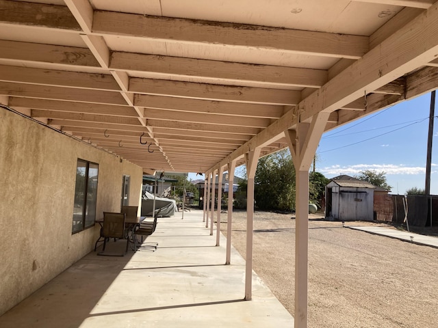 view of patio / terrace featuring a storage shed