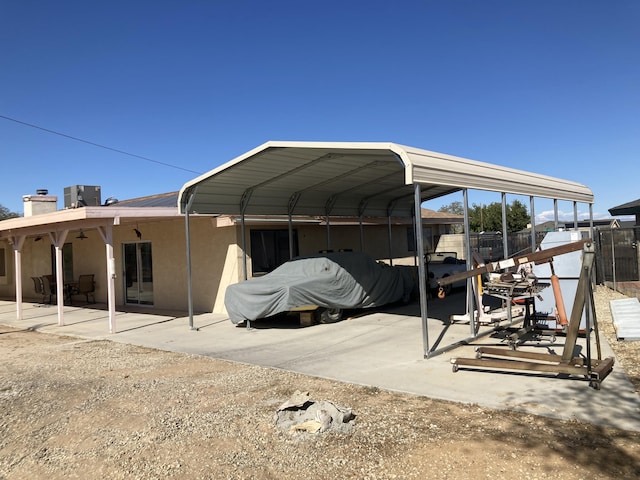 view of parking / parking lot featuring a carport