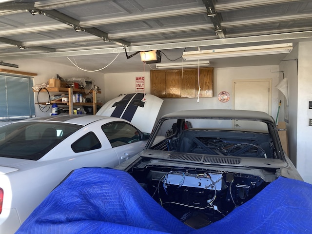 garage featuring a garage door opener