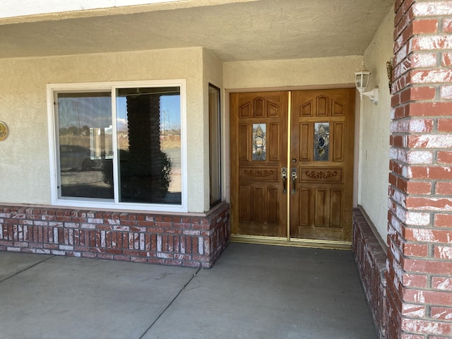 property entrance with covered porch