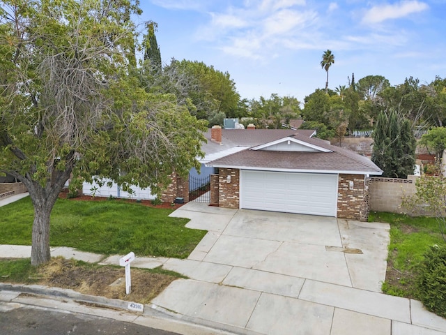 view of front facade with a front lawn and a garage