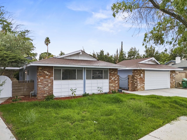 ranch-style home featuring a front yard and a garage