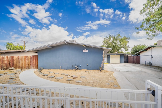 view of side of property featuring a garage