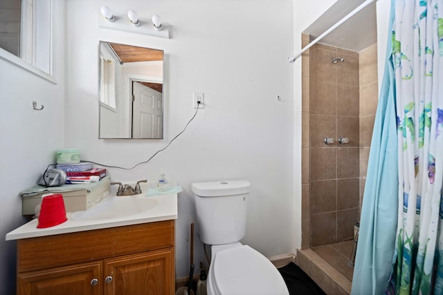 bathroom with a shower with curtain, vanity, and toilet