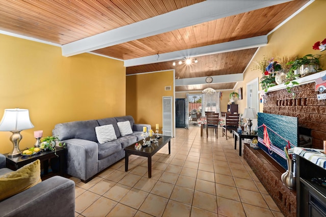 tiled living room with vaulted ceiling with beams, wood ceiling, and a brick fireplace