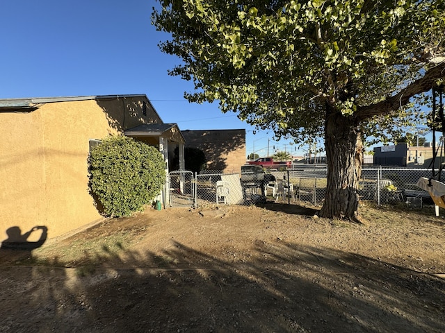 view of yard featuring a gate and fence