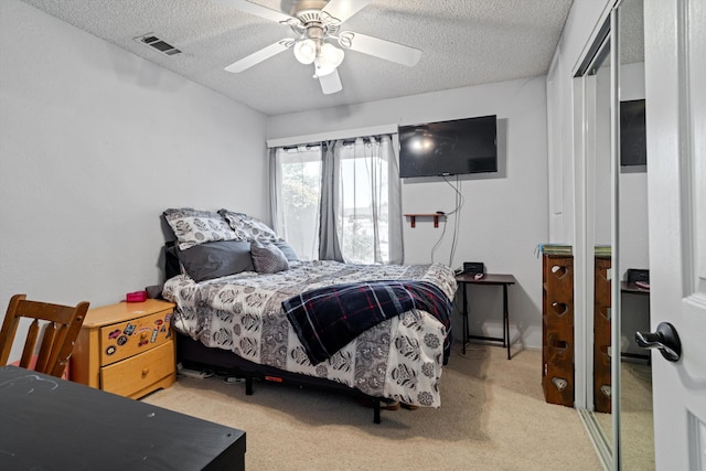 2303 Dallin St, Lancaster, CA 93536 - carpeted bedroom featuring a textured ceiling, visible vents, and ceiling fan