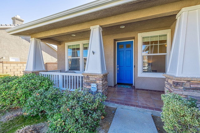 doorway to property featuring a porch