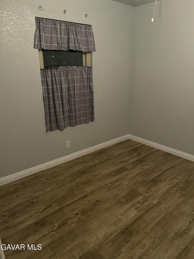 3657 Imperial Ave, Rosamond, CA 93560 - spare room with dark wood finished floors