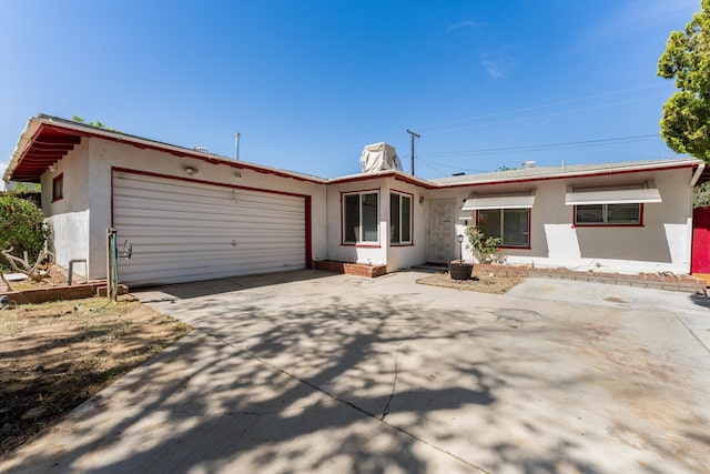 44129 Date Ave, Lancaster, CA 93534 - single story home with stucco siding, an attached garage, and concrete driveway