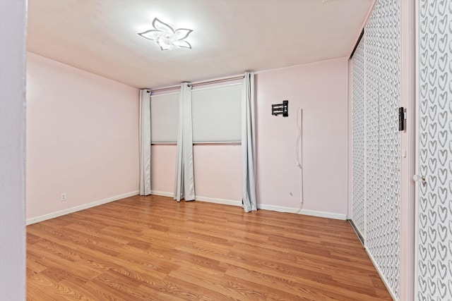 44129 Date Ave, Lancaster, CA 93534 - unfurnished bedroom featuring light wood-style floors and baseboards