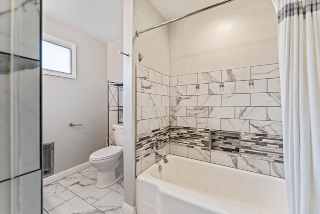 44129 Date Ave, Lancaster, CA 93534 - full bath featuring marble look tiles, toilet, shower / bathtub combination with curtain, and baseboards