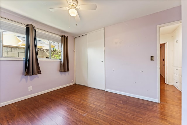 44129 Date Ave, Lancaster, CA 93534 - unfurnished bedroom with wood finished floors, baseboards, a closet, and ceiling fan