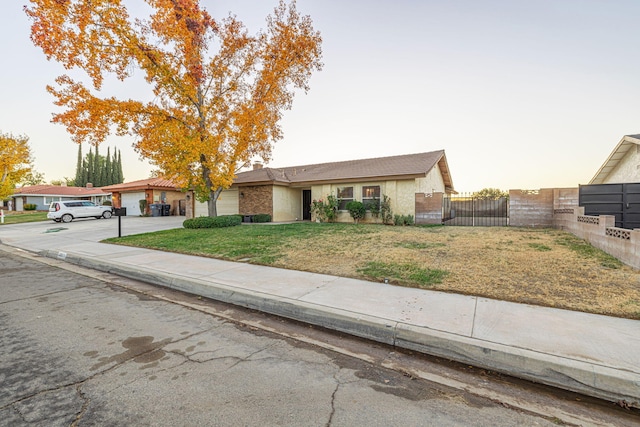 ranch-style house featuring a yard