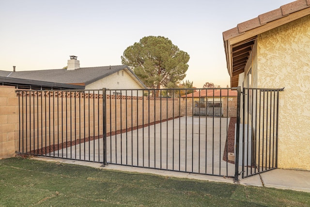 view of gate at dusk