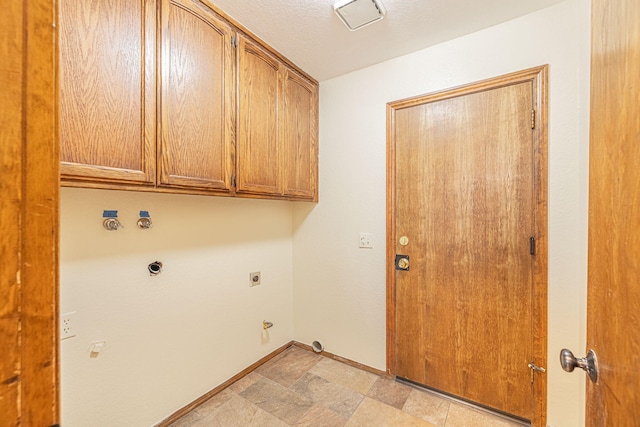 laundry room with cabinets, gas dryer hookup, and electric dryer hookup