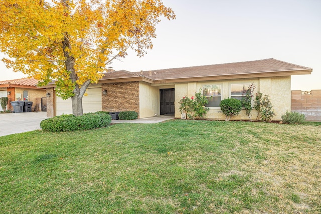 ranch-style house with a garage and a front yard