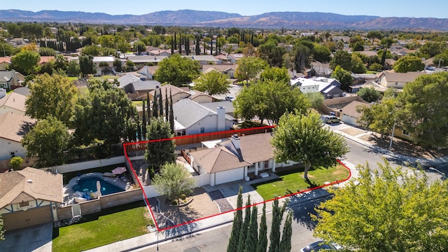 birds eye view of property featuring a mountain view