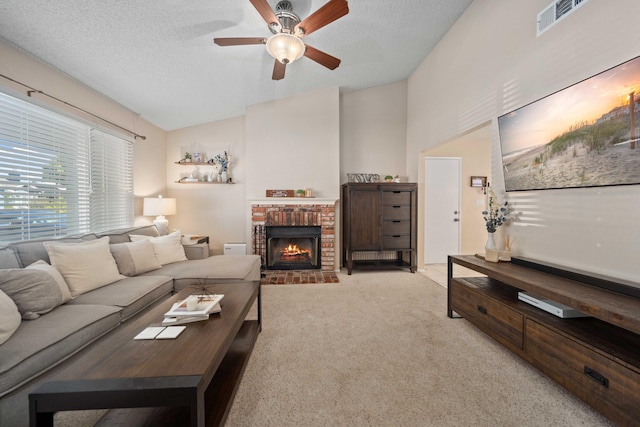 living room featuring lofted ceiling, light carpet, and a textured ceiling