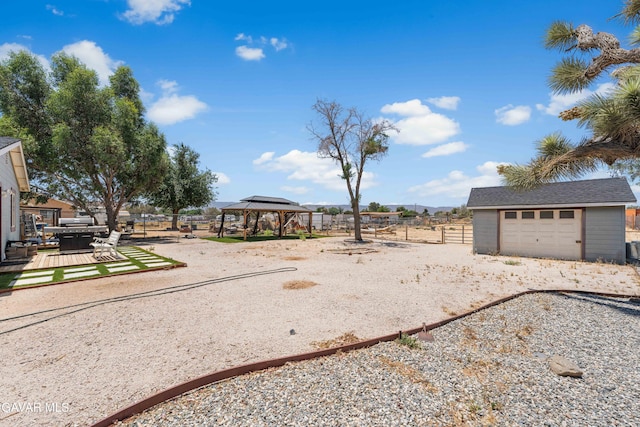 43249 W 42nd St, Lancaster, CA 93536 - view of yard featuring a gazebo, an outbuilding, and a garage
