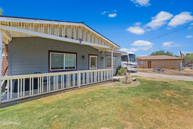43249 W 42nd St, Lancaster, CA 93536 - view of property exterior with a lawn