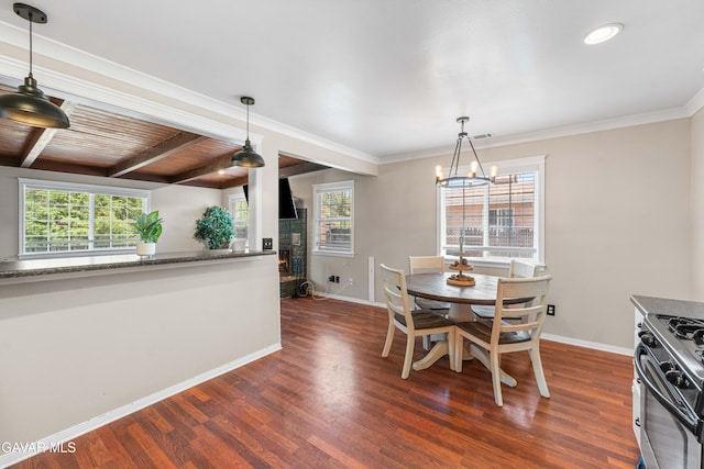 43249 W 42nd St, Lancaster, CA 93536 - dining area with dark wood finished floors, a chandelier, and beamed ceiling