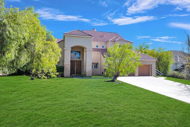 mediterranean / spanish-style home featuring a front lawn, driveway, and a tiled roof